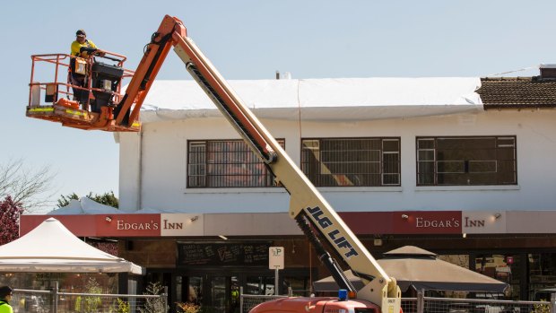 Loose-fill asbestos is removed from Ainslie shops this month, albeit without a moral panic.