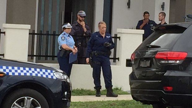 Police outside the house in Lockwood Street, Merrylands.