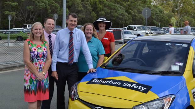 Brisbane City councillors Angela Owen Taylor, Adrian Schrinner, Lord Mayor Graham Quirk, Madonna Stewart from the P&C Association of Queensland LD and Calamvale Community College principal Lisa Starmer with one of the hi-vis parking enforcement vehicles (file pic).