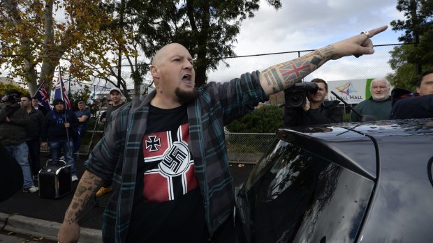 Glenn Anderson shouts at a Muslim woman at an anti-Islam rally in May 2015.