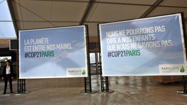 Boards reading "The planet is in our hands" and "We cannot say to our children that we did not know" are pictured on the site of the UN Climate Conference scheduled for Paris at the end of the month.