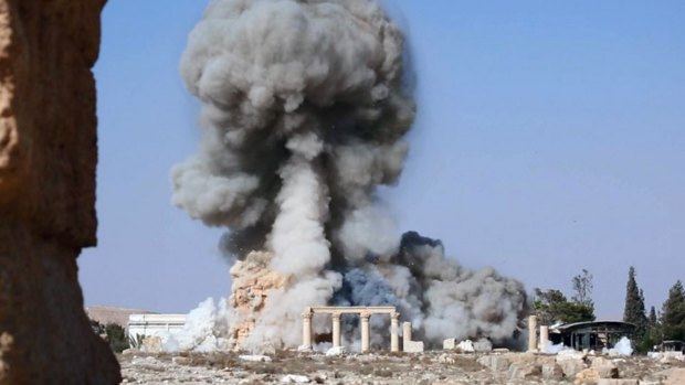 Smoke from the detonation of the 2000-year-old temple of Baalshamin in Syria's ancient caravan city of Palmyra, seen in this undated photo which was posted last year on a social media site used by Islamic State militants.