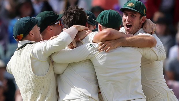 Well-urned: Australian players celebrate regaining the Ashes in Perth.