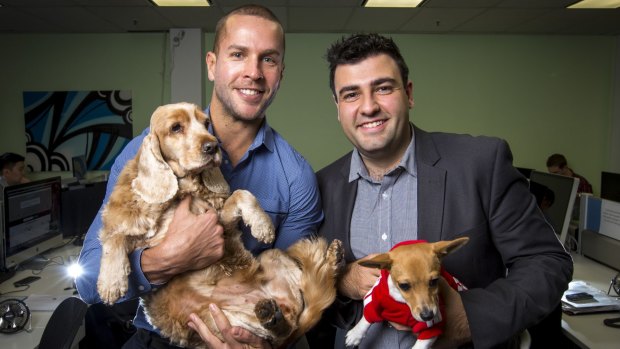 Ray Milidoni, general manager (right), and Nick Bell, managing director, with dogs belonging to staff at WME Group.