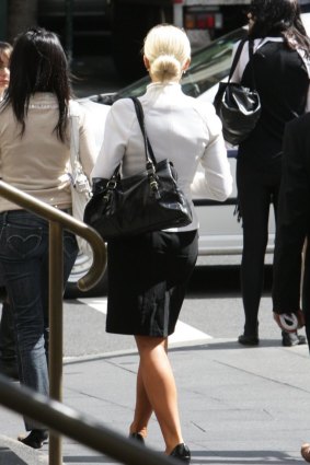 Lowe's victim, with blonde hair, leaves court in 2009 after the love-rat was convicted of raping and assaulting her. 