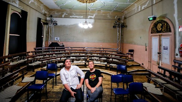 Luke Hilakari (right) and Matt Kunkel in Trades Hall, which will undergo a $10 million restoration.