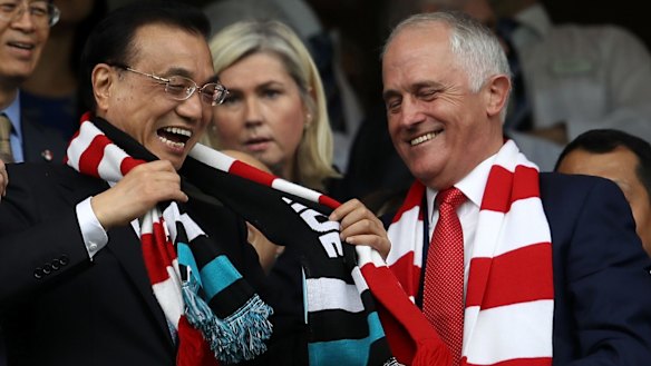 Chinese Premier Li Keqiang and Prime Minister Malcolm Turnbull share a joke at the Sydney Cricket Ground.