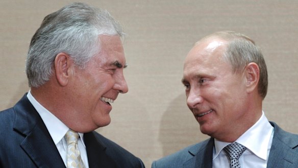 Picture from happier times: Exxon Mobil's chief executive, Rex Tillerson, with Russian President Vladimir Putin. 
