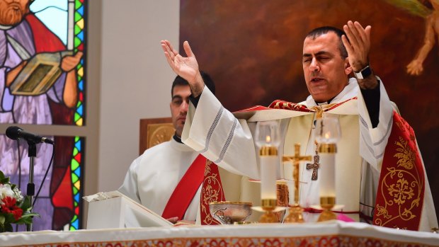 Iraqi Chaldean Archbishop Amel Nona holds Christmas Mass at St Mary's Assumption Church in Fairfield, Sydney.