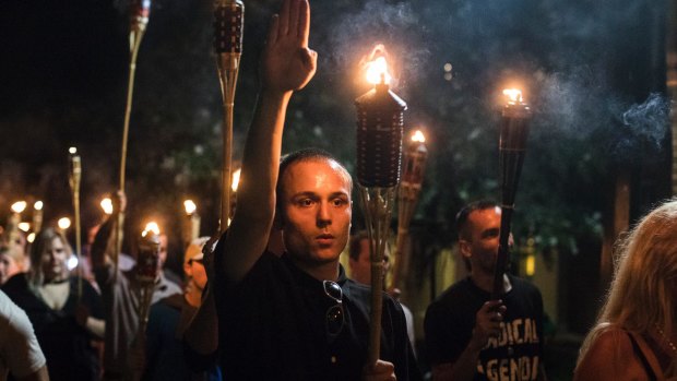 A white supremacist gives a Nazi salute in Charlottesville.