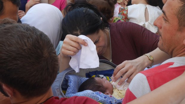 Baby Malia is eight days old. Her mother fled the ruins of Kobane, Syria.