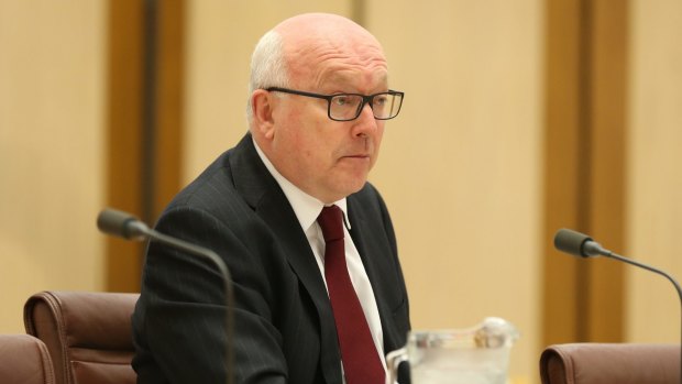 Attorney-General Senator George Brandis looking somewhat perkier than in the final hours of the inquiry.