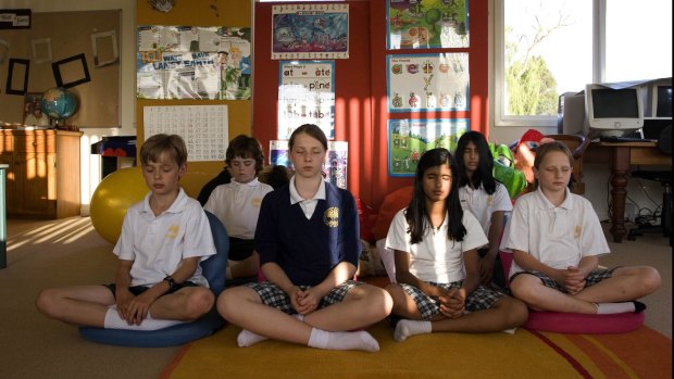 Students meditate at the Maharishi school. 