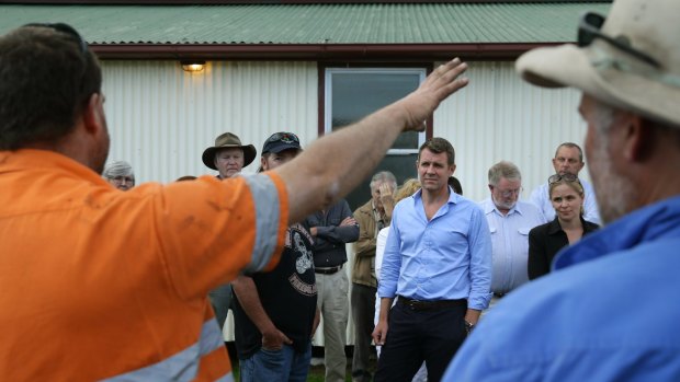 Premier Mike Baird hears from a miner opposed to the expansion of the Rio Tinto mine near Bulga.