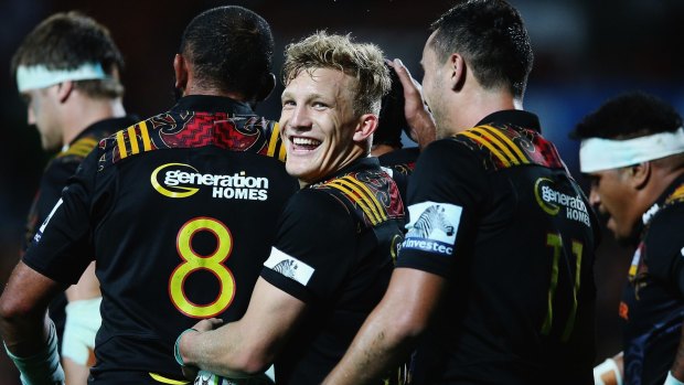 Too easy: Damian McKenzie of the Chiefs celebrates with teammates.