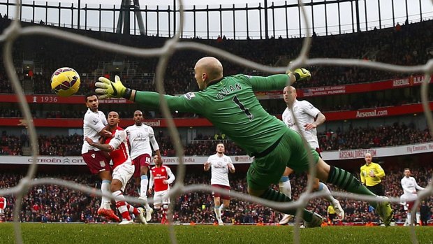 Theo Walcott beats Villa keeper Brad Guzan to score for Arsenal at the Emirates on Sunday. 