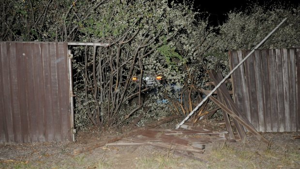 Fence of a Weetangera home smashed after Thursday night crash. 