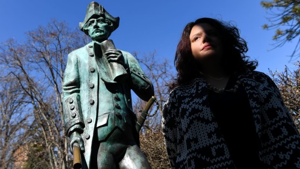 Genevieve Grieves next to the Captain James Cook statue at Cook's Cottage in Fitzroy Gardens.