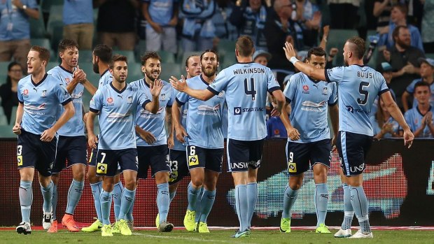 Chasing records: Filip Holosko and Sydney FC celebrate a special goal.