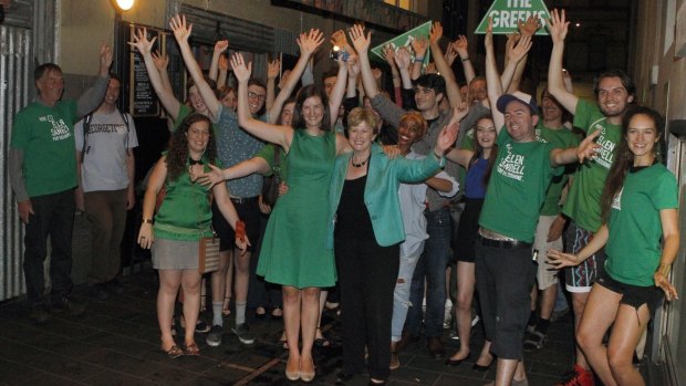 New Greens Member for Melbourne, Ellen Sandell, celebrates with supporters.