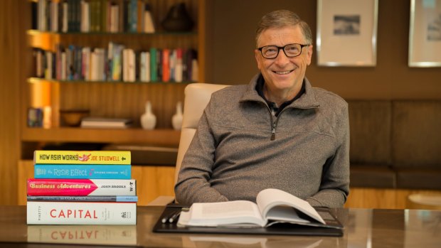 Bill Gates in 2014 with his some of his favourite books from that year.  In Business @ the Speed of Thought, Gates explains how business and technology are inextricably linked.