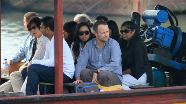 Febyanti Herewila (sitting in the middle) on the way to  Nusakambangan island to visit her fiance Andrew Chan. 
