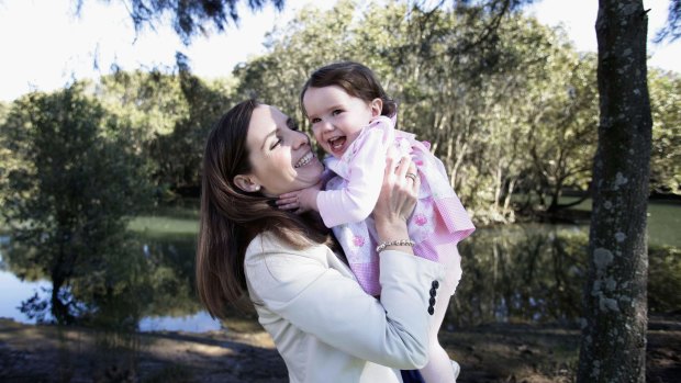 Labor MP Courtney Houssos, pictured with her daughter Anna, wants parliament to change the rules banning young children from the House.
