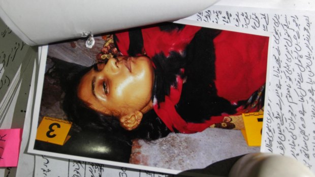 A picture of Tasleen, who was slain by her brother, with police records at police headquarters in Lahore, Pakistan. 