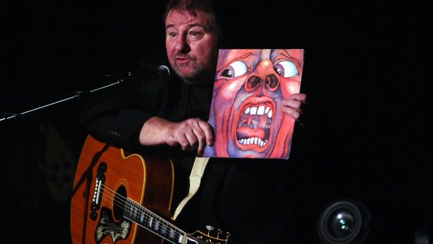 Greg Lake with King Crimson album cover performs solo concert in Bologna, Italy, 2012. 