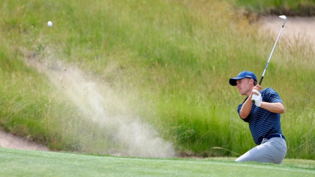 Sandy lie: Jordan Spieth hits out from one of Erin Hills' notorious bunkers during a practice round.
