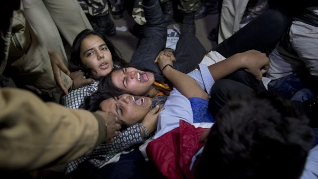 Young Indians are detained by police during a protest against the release of a juvenile convicted in the fatal 2012 gang rape that shook the country.