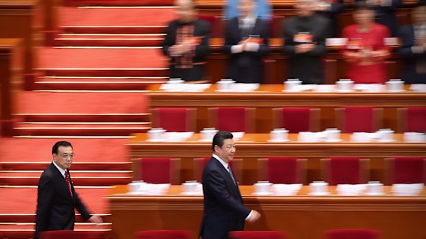 President Xi Jinping, right, and Premier Li Keqiang arrive for a session of China's parliament, the National People's Congress, in Beijing.