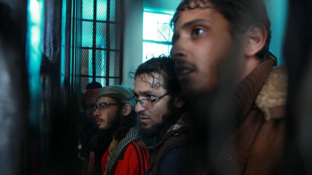 Suspected al-Qaeda militants stand behind bars during a hearing at the appeals court earlier in November. Seven al-Qaeda militants were killed in the latest operation.