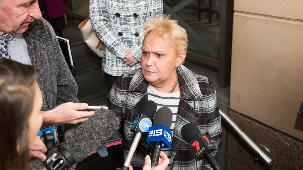 Kylie's mother talks to the media on Monday.