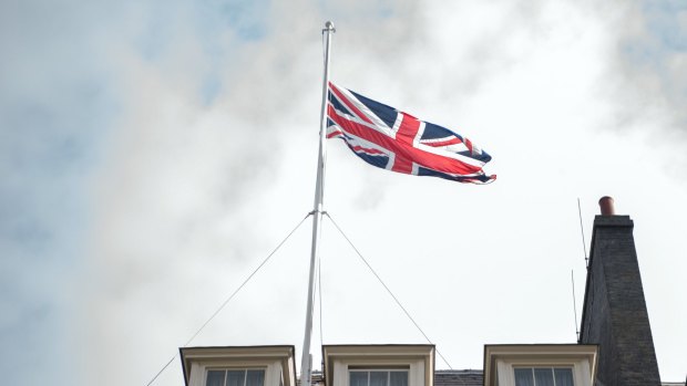 The Union flag flies at half mast over the prime minister's residence, 10 Downing Street, in London.