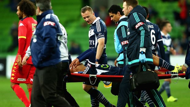 Archie Thompson is stretchered off the field.