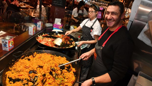 John Kyzintas says he and his staff cook paella 'with passion'.