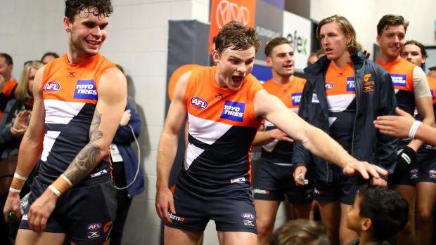 Mood change: Heath Shaw of the Giants and team mates celebrate as they greet fans in their changeroom after besting Fremantle.