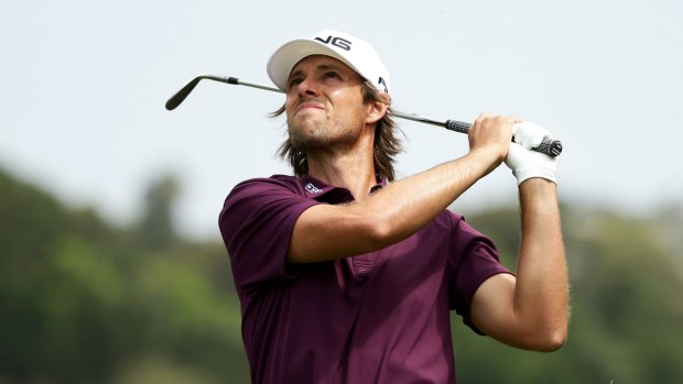 Aiming high: Aaron Baddeley fires at the 15th pin during Saturday's third round.