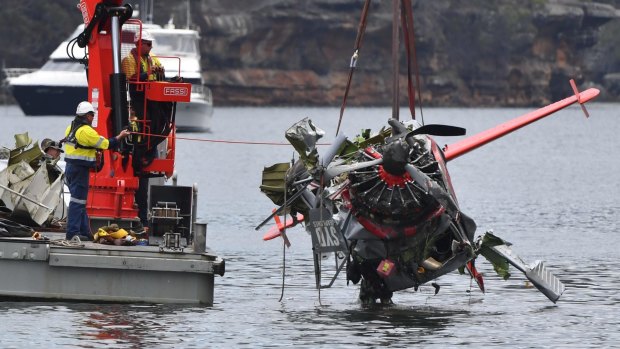 NSW police and salvage personnel work to recover the wreckage of a seaplane that crashed into Jerusalem Bay, north of Sydney on Thursday.