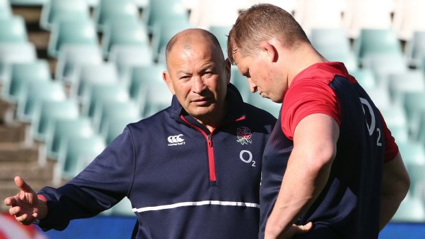 England rugby captain Dylan Hartley, right, listens to coach Eddie Jones during a captain's run in Sydney Friday, June 24, 2016. England will try to make a clean sweep 3-0 when they play Australia in the 3rd test on Saturday, June 25. (AP Photo/Rob Griffith)