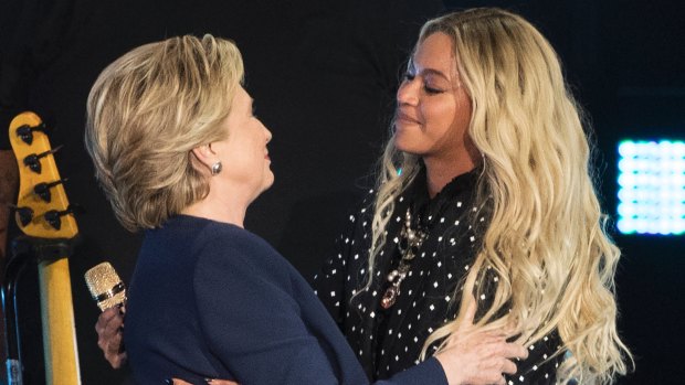 Beyonce and Democratic presidential candidate Hillary Clinton embrace during a campaign rally in Cleveland.
