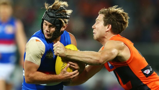 Knockout blow: Toby Greene could end up with a suspension for his hit on Bulldog Caleb Daniel.