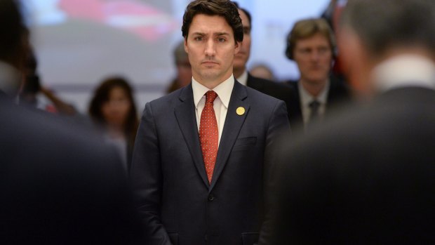 Canada's Prime Minister Justin Trudeau takes part in a moment of silence to remember the victims of Friday's Paris attacks.