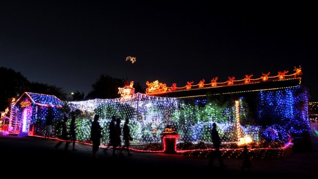 Master at work: Phil Jensen's home in Bissenberger Crescent, Kambah, is a symphony of Christmas lights.