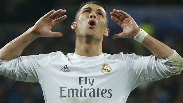 Unstoppable force: Ronaldo plays to the crowd after a heroic performance against Wolfsburg.