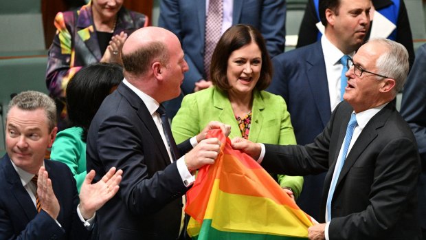 Malcolm Turnbull celebrates with colleagues after the House of Representatives legalised same-sex marriage.