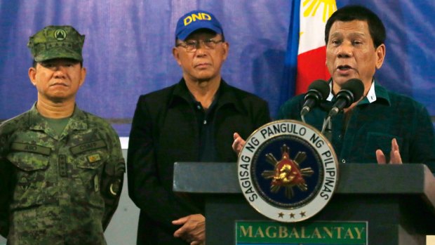 Philippine President Rodrigo Duterte, right, addresses the 2nd Mechanized Brigade  on Friday near Iligan city in the southern Philippines.  