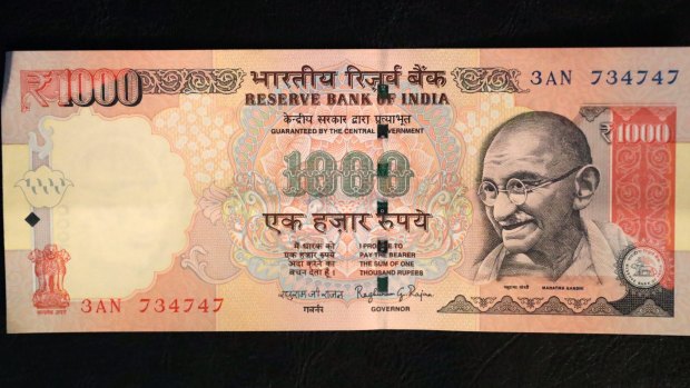 A 1000 rupee Indian currency note which is being withdrawn from midnight on Wednesday.