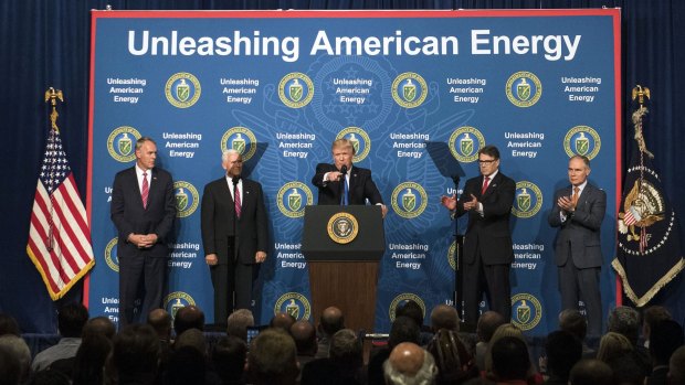 US President Donald Trump, centre, speaks during the Unleashing American Energy event at the Department of Energy,  as he seeks to reorient the government away from fighting climate change and toward American "energy dominance".
